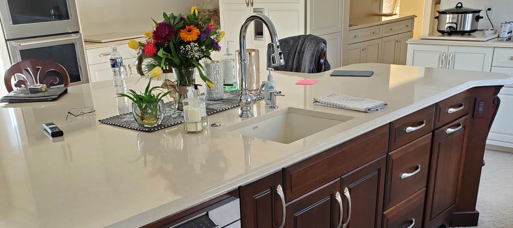 Kitchen island sink with things all over