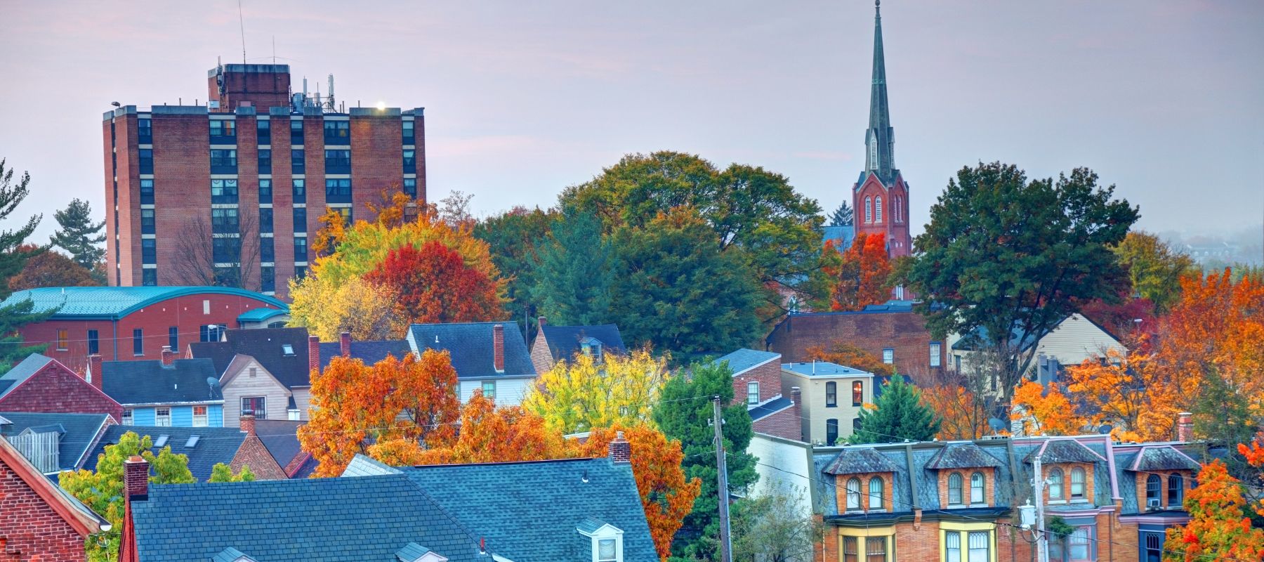 pennsylvania city during the fall with colorful fall foliage and historical looking buildings
