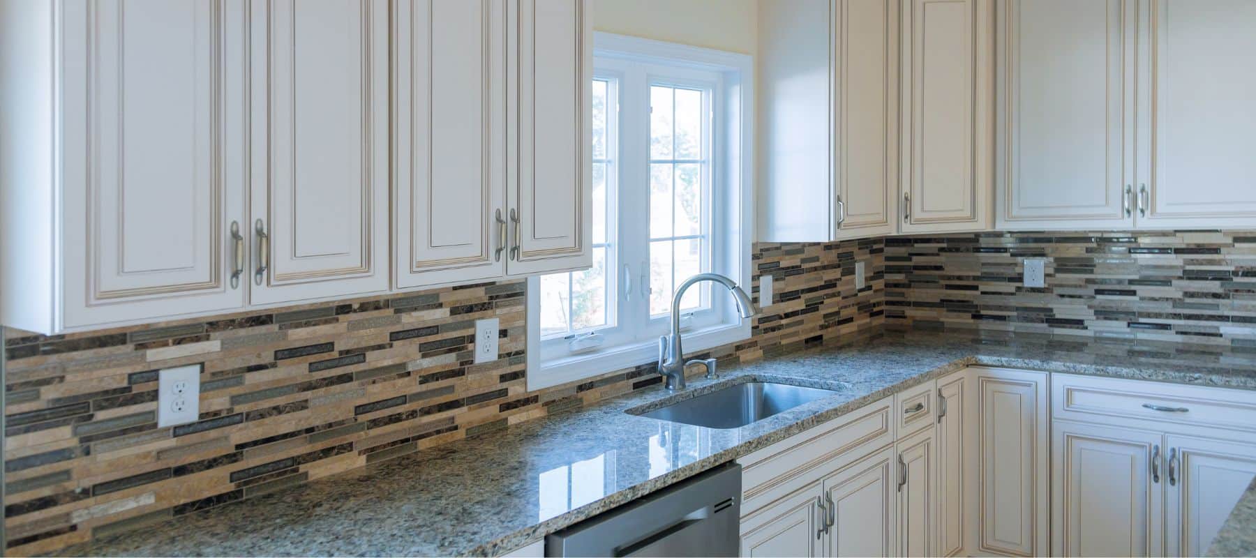 newly remodeled kitchen with luxury backsplash