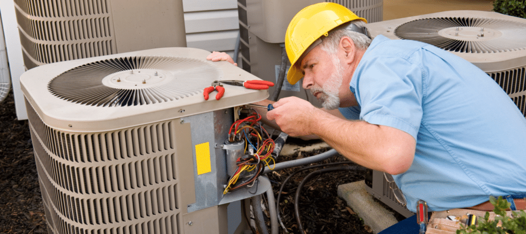 HVAC technician repairing an outdoor air conditioning unit, Technician repairing home HVAC unit to restore steady indoor comfort